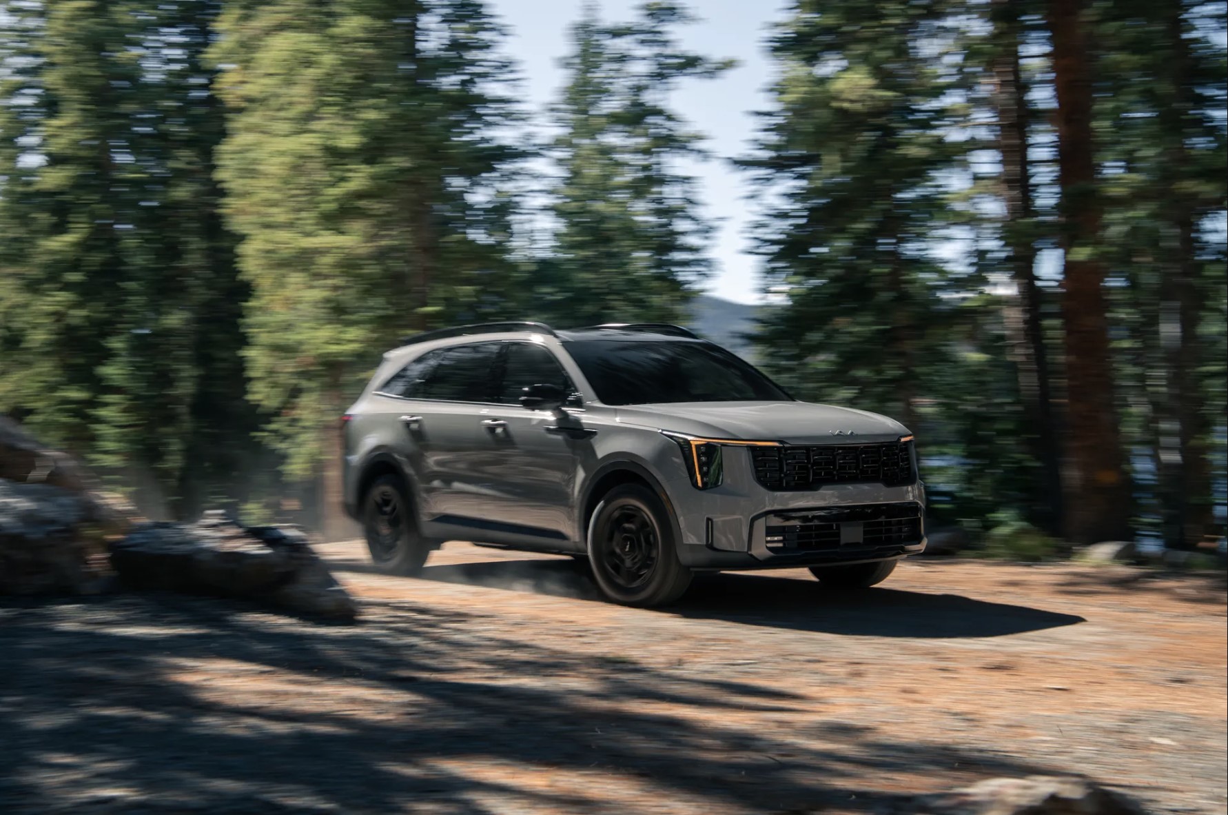 The 2024 Kia Sorento X-Pro off-roading in the woods