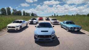 A lineup of the Ford Mustang GT generations throughout the years.