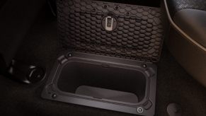 The underfloor storage compartment in a Ram 2500 heavy-duty pickup truck.