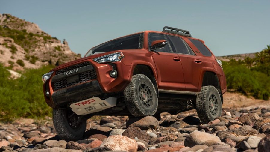 Bronze-colored 2024 Toyota 4Runner TRD Pro off-road SUV on a tough trail.