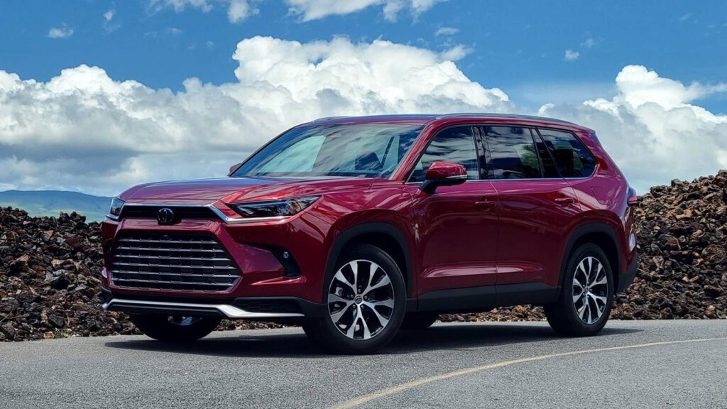 2024 Toyota Grand Highlander in Red, posed. This larger Toyota midsize SUV brings more comfort, quality, and power to your drive.