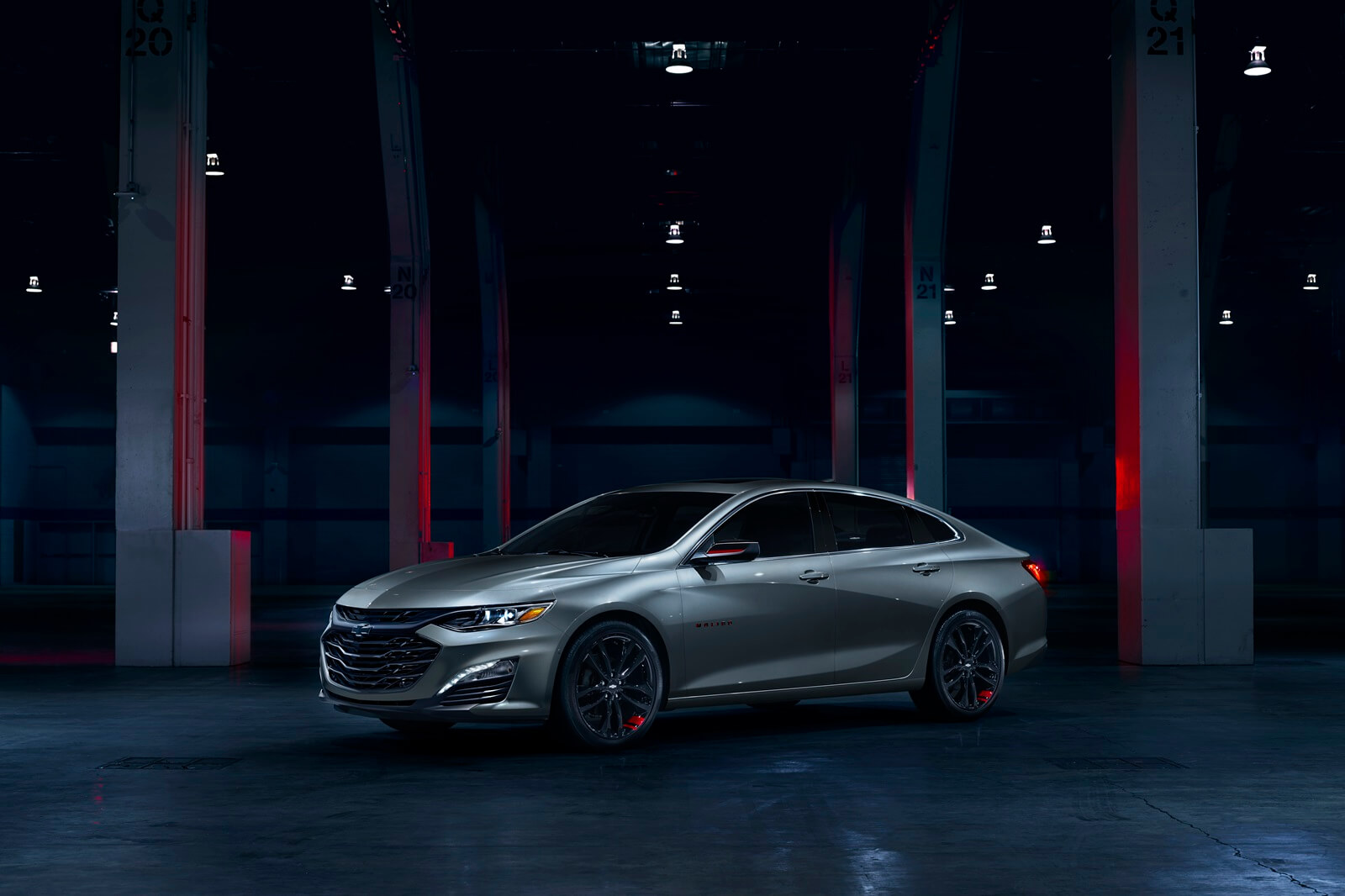 A 2024 Chevrolet Malibu in a dark garage. 