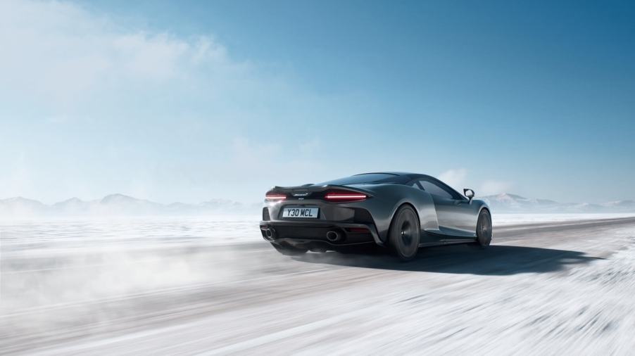 A 2025 McLaren GTS kicks up dust on a salt flat.