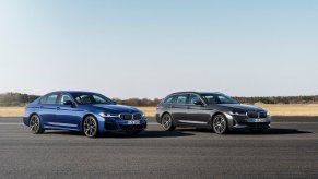 A set of BMW 5 Series cars, some of the models with the worst depreciation, sit on the tarmac.