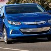 Blue 2019 Chevy Volt PHEV driving on a highway.