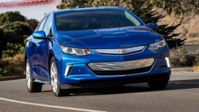 Blue 2019 Chevy Volt PHEV driving on a highway.