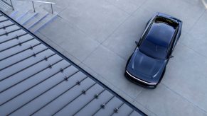 A pre-production 2025 Dodge Charger parks on an apron.