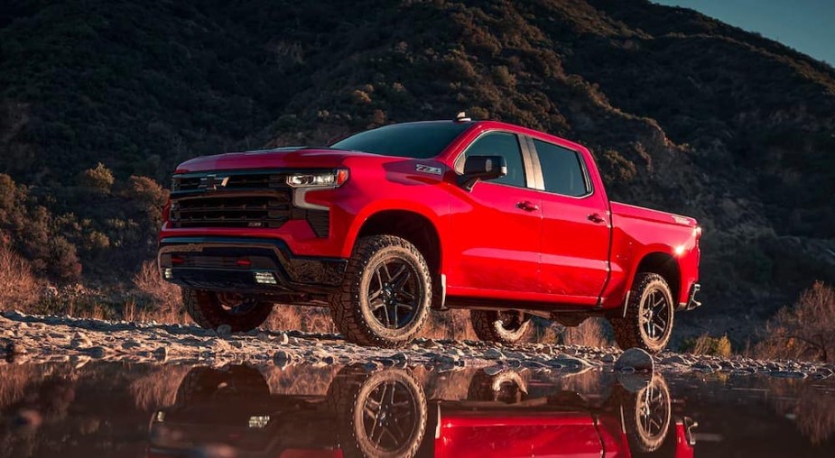 The 2023 Chevy Silverado  parked near water