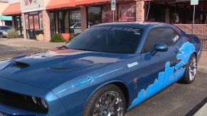 A Detroit Lions-themed Dodge Challenger R/T Scat Pack shows off its livery.