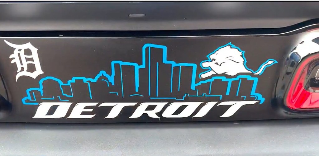 A Dodge muscle car shows off its Detroit graphic. 