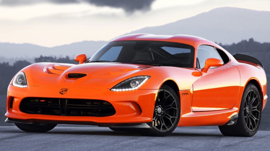 Orange Dodge Viper posed on a track. Two models of the dead Dodge Viper car model were sold last year.