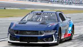 A 2024 Ford Mustang Dark Horse NASCAR Cup car on track