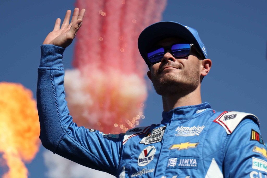 Kyle Larson, driver of the #5 HendrickCars.com Chevrolet, waves to fans onstage during driver intros prior to the NASCAR Cup Series Championship at Phoenix Raceway on November 05, 2023 in Avondale, Arizona.