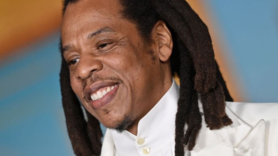 Jay-Z, a famed car collector and hip-hop icon, smiles at an event.