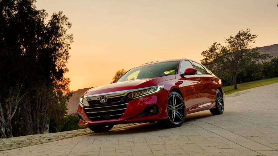 A red Honda Accord Touring Hybrid shows off its front-end styling.