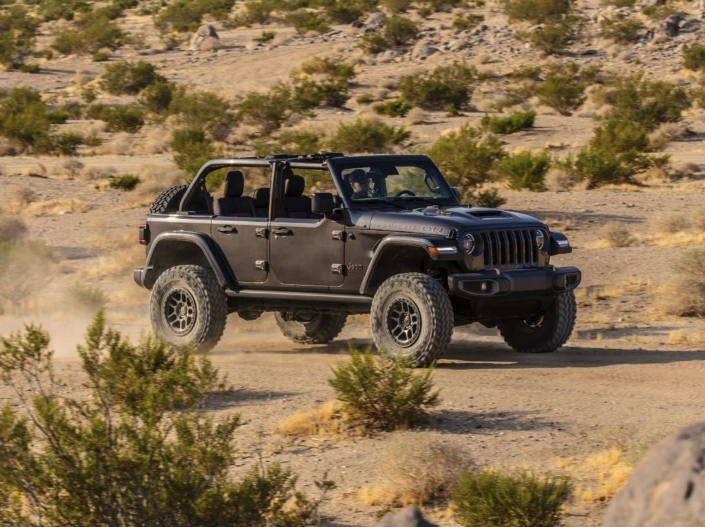 The 2023 Jeep Wrangler Rubicon 392 kicking up sand