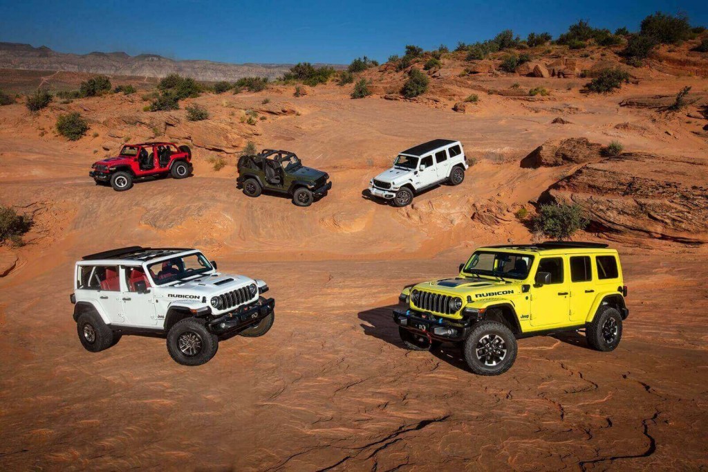 A series of Jeep Wrangler show off their yellow, white, green, and red car colors.