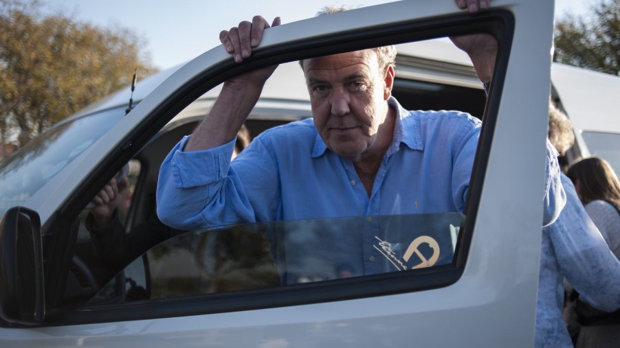 Top Gear and The Grand Tour host Jeremy Clarkson stands by a car door.