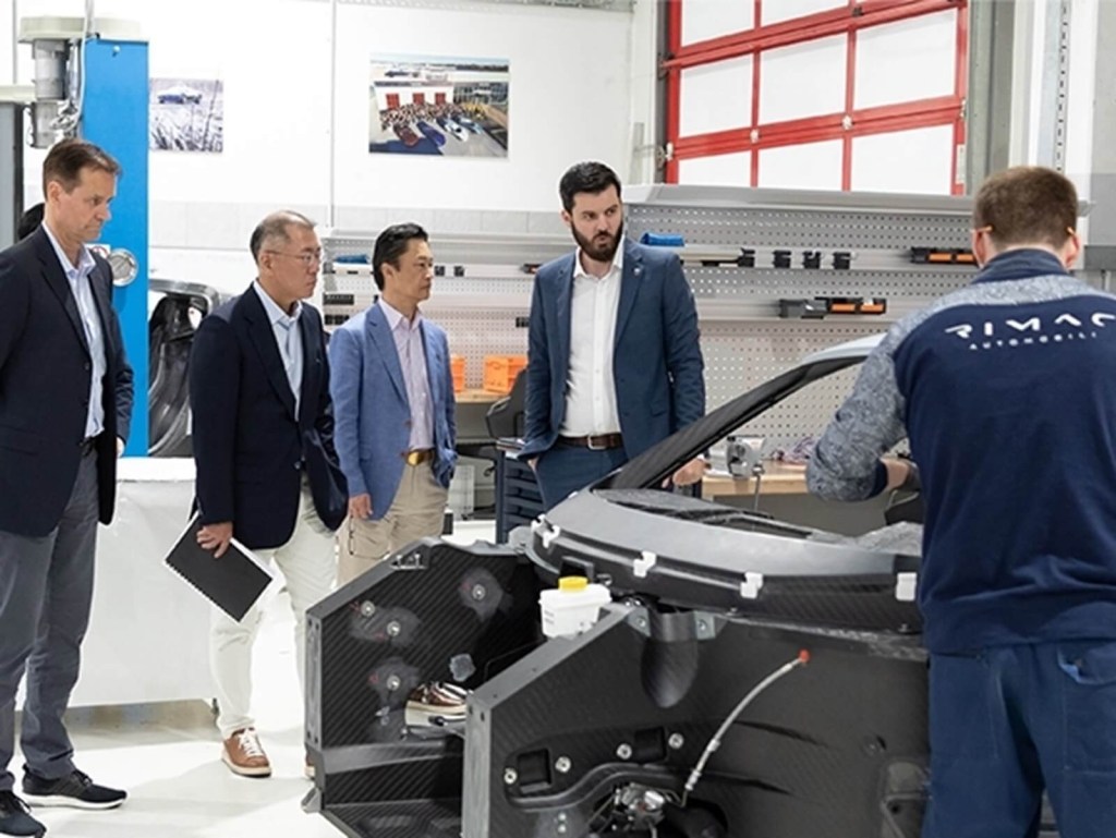 Kia personnel visit Rimac Automobili along with Mate Rimac to plan investments in driverless taxi tech.