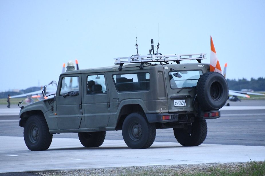Military Toyota Mega Cruiser on a runway