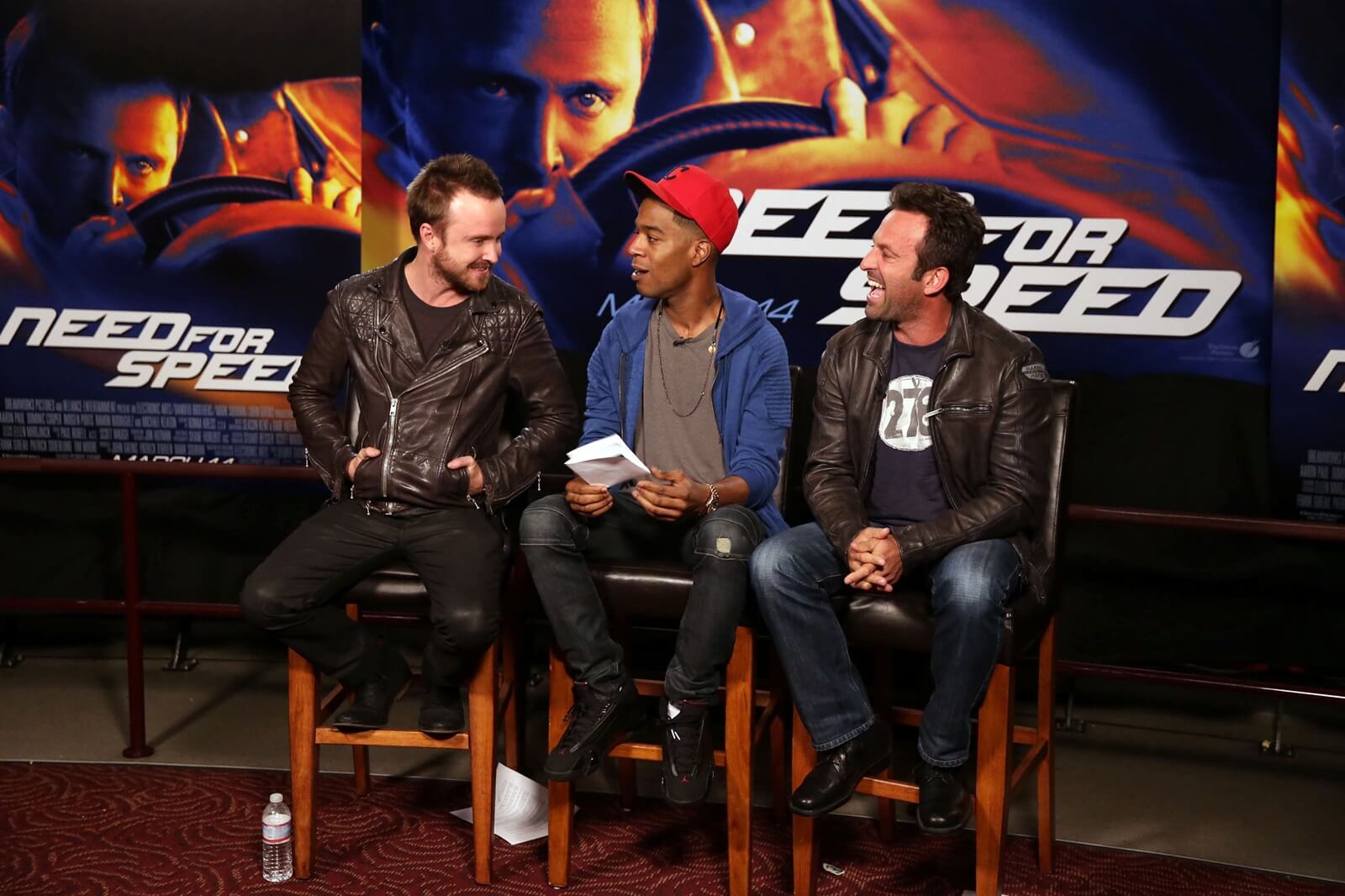 Director Scott Waugh, Aaron Paul, and Kid Cudi at an event to promote the Need for Speed movie.