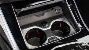 A BMW X5 shows off its heated cup holders.