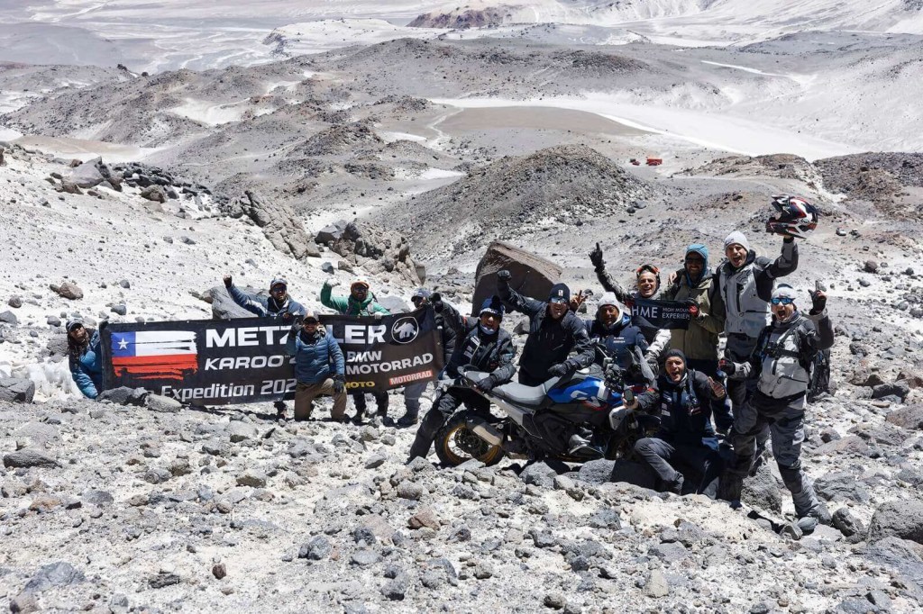 The BMW motorcycles team celebrates on Ojos del Salado in Chile. 