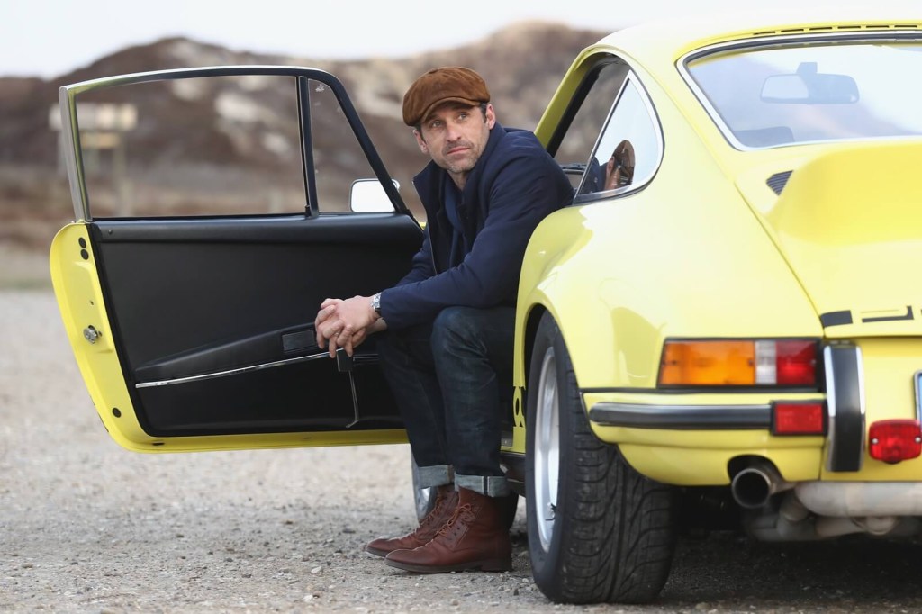 Patrick Dempsey with a Porsche 911 during a photoshoot for cars. 