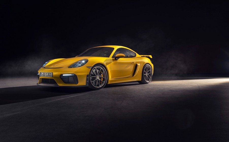 A yellow Porsche 718 Cayman GT4 shows off its front-end styling.