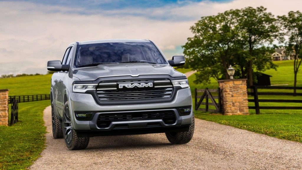 Ram 1500 Ramcharger driving on a gravel road. This PHEV truck solves EV truck towing challenges.