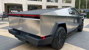 The bed of Tesla's electric Cybertruck parked in a city.