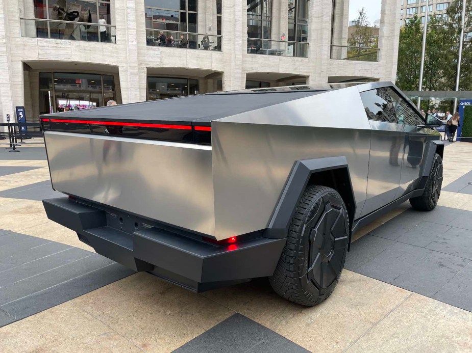 The bed of Tesla's electric Cybertruck parked in a city.