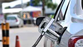 A compress natural gas (CNG) bi-fuel car refuels