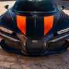 A black and orange 2022 Bugatti Super Sport 300+ the world's fastest production car front view