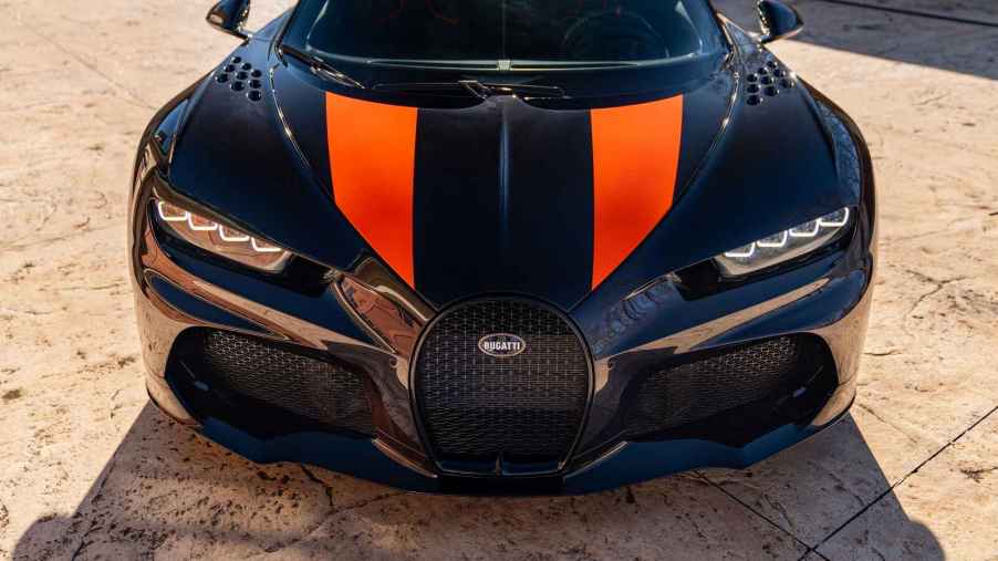 A black and orange 2022 Bugatti Super Sport 300+ the world's fastest production car front view