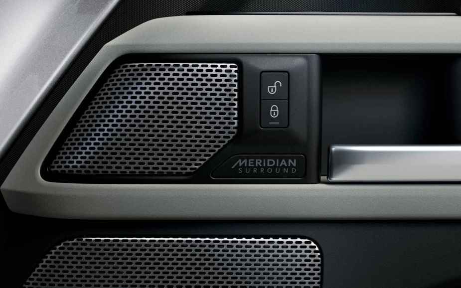 A Meridian car door speaker is shown in close proximity