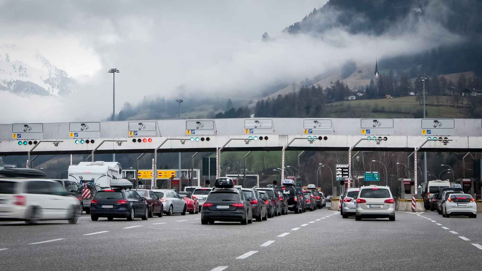 A toll road queue on a cloudy day