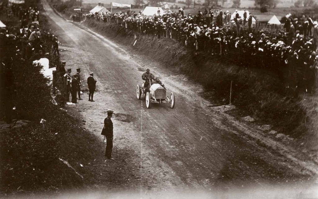 The 1903 Mercedes-Simplex 60 HP shown driving the dirt course of the 1903 Gordon Bennett Race.