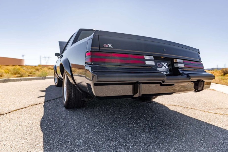 Rear trunk of a black Buick Grand National GNX muscle car.