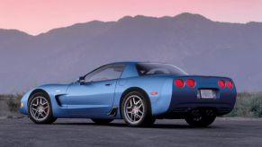 A blue Chevrolet Corvette Z06 sports car shows off its rear-end styling.