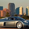 Mid-engine Chrysler supercar concept parked in front of a skyline.