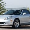 Silver 2005 Toyota MR2 Spyder sports car posed in front of an outdoor scene.