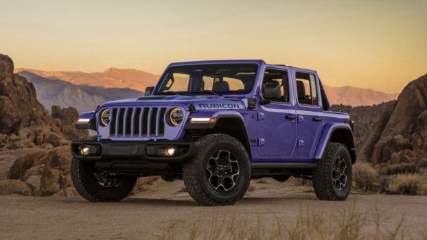 The 2023 Jeep Wrangler off-roading at dusk