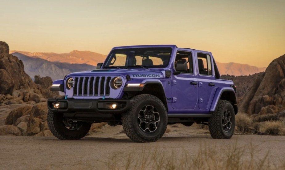 The 2023 Jeep Wrangler off-roading at dusk