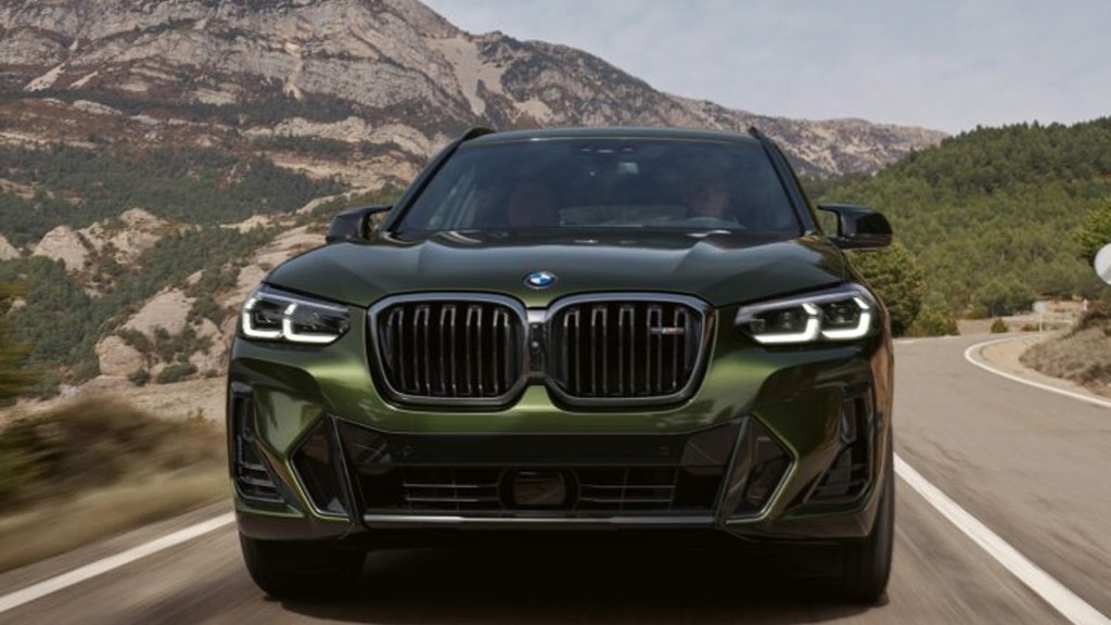 2024 BMW X3 driving on a road. The new 2026 BMW iX3 compact luxury electric crossover SUV should be about the same size as the current X3.