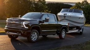 2024 Chevrolet Silverado HD Towing a boat. This truck could have a larger Duramax diesel engine in the future.