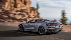 A gray 2024 Corvette E-Ray 3LZ on a coastal road.