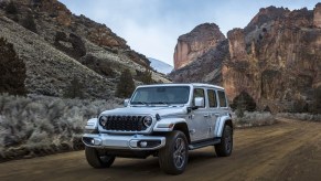 The 2024 Jeep Wrangler on a dirt road