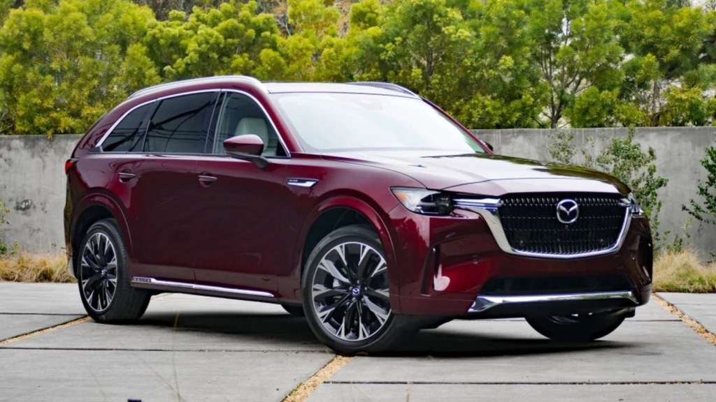 2024 Mazda CX-90 midsize SUV posed.  This SUV can be powered with the new inline 6-cylinder Mazda engine.