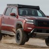 The 2024 Nissan Frontier Forsberg Edition jumping through mud